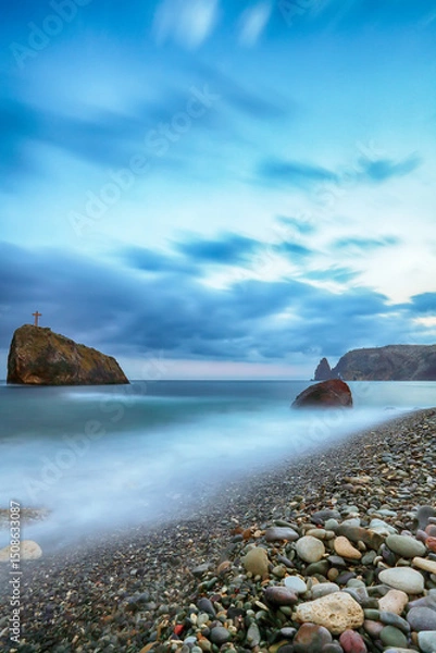Fototapeta Amazing view of the beach and rocks shot with a long exposure.