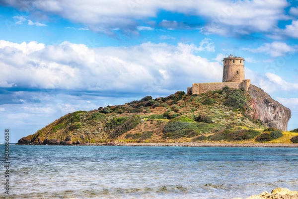 Fototapeta Fabulous view on Ancient Spanish tower of Coltellazzo of Saint Efisio lighthouse at Nora archeological site