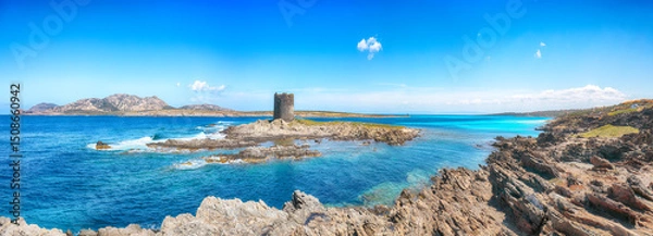 Fototapeta Unbelivable morning view of famous La Pelosa beach and rocky shore near Torre della Pelosa
