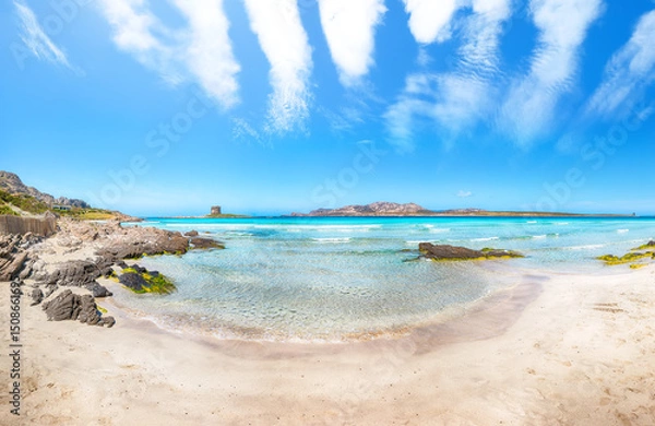 Fototapeta Unbelivable morning view of famous La Pelosa beach and rocky shore near Torre della Pelosa