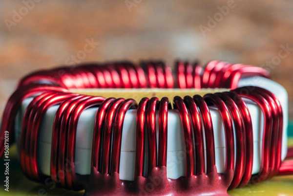Obraz Copper coil on an electronic board, close-up view