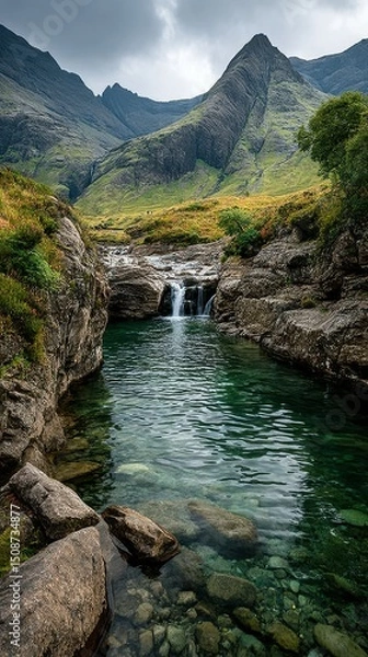 Fototapeta Serene mountain landscape featuring a tranquil river and cascading waterfall in a lush valley