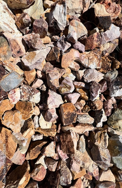 Obraz rocks in different shapes and colors in brown and yellow tones filling the frame