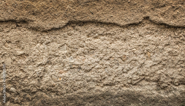 Obraz Rough textured earth wall surface showing layers of soil and sediment for background