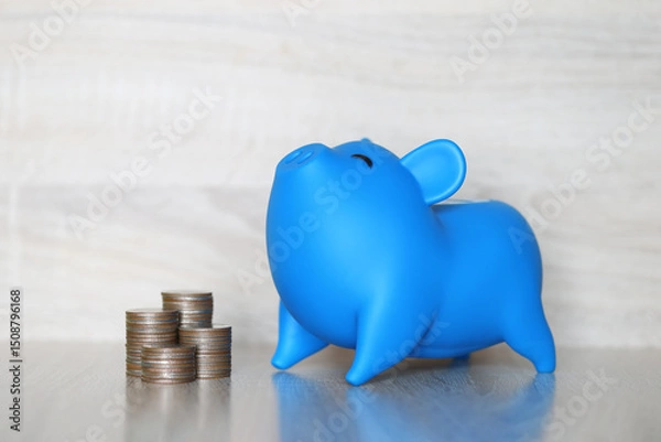 Obraz Piggy bank and stack of coins money on wooden background, Save money for prepare in future and pension retirement concept