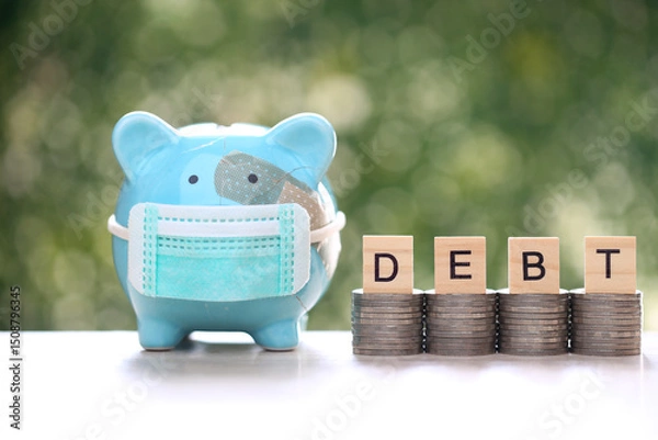Obraz Piggy bank attached to the plaster on the head and stack of coins money on green background, Save money for Medical insurance and Health care concept