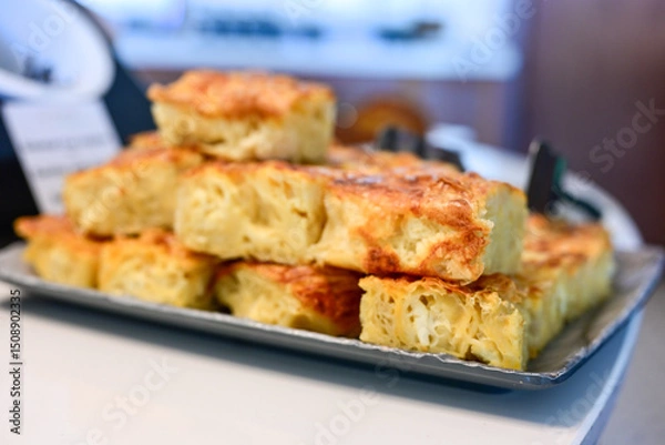 Fototapeta Bakery .Home made  cheese pie  with phyllo pastry, feta cheese  and organic eggs. Bulgarian banitsa. Brekfast on a display at Hotel