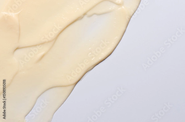 Fototapeta The texture of a cosmetic cream or balm. Copy space