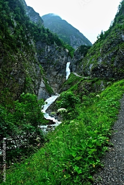 Fototapeta Austrian Alps - view of the Simms waterfalls in the Hohenbachtal gorge near the town of Holzgau in the Lechtal Alps