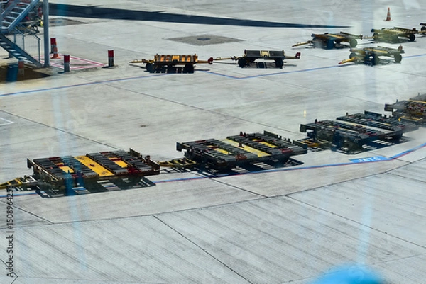 Fototapeta The view of empty airport baggage cart. For transporting baggage. Airport scene.