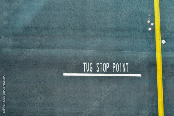 Fototapeta Looking from the top of the sign of Tug stop point at the airport. Traffic sign. Transportation concept.