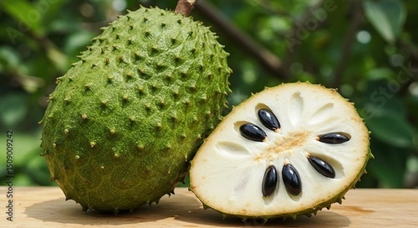 Obraz Soursop Cut and Uncut with Seeds on Wood Surface High Angle Exotic Tropical Fruit