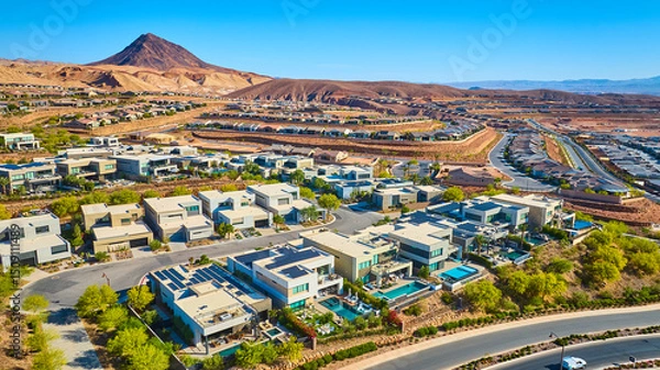 Fototapeta Aerial Modern Desert Homes with Pools and Mountain Backdrop Fly Through