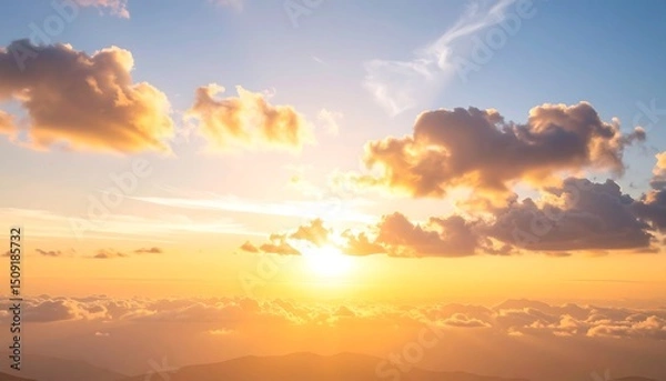 Obraz Vibrant sunset over a landscape of clouds and mountains