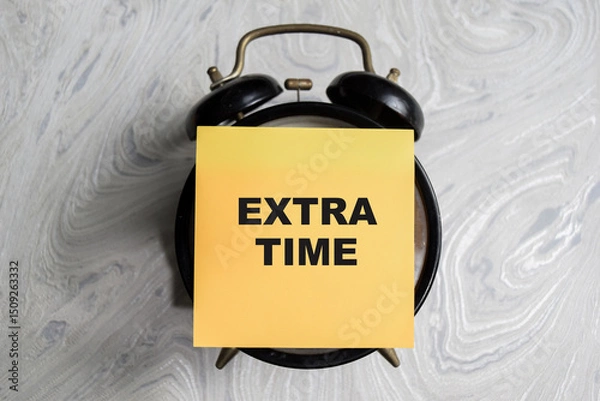 Obraz Concept of Extra time write on sticky notes isolated on Wooden Table.