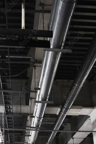 Obraz Piping and power distribution equipment in exposed ceilings of heavy steel frame buildings