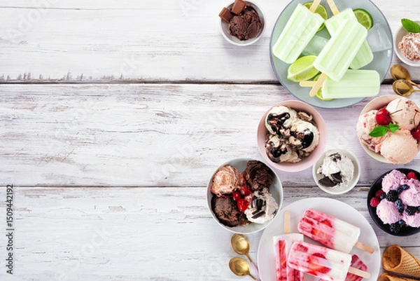 Obraz Cool summer food side border. Variety of ice cream bowls, popsicles and frozen treats. Top view on a white wood background. Copy space.