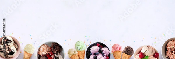 Obraz Summer ice cream bottom border. Bowls and cones of colorful assorted flavors. Top view on a white marble banner background. Copy space.