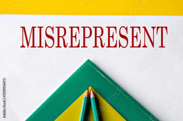 Fototapeta MISREPRESENT - word close-up on white sheet with folders and pencils