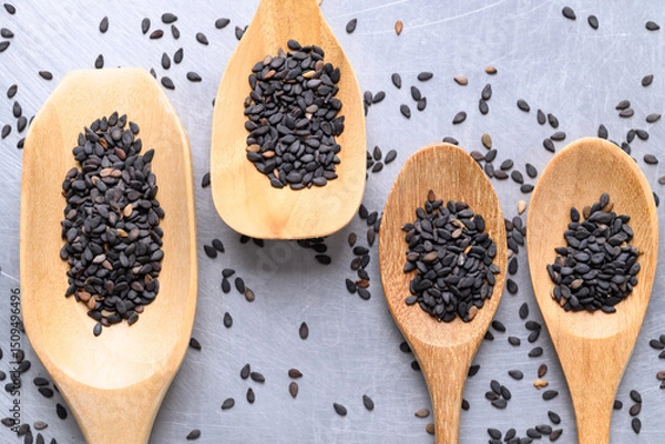 Obraz Black sesame seed in wooden spoon, Food ingredient, Top view