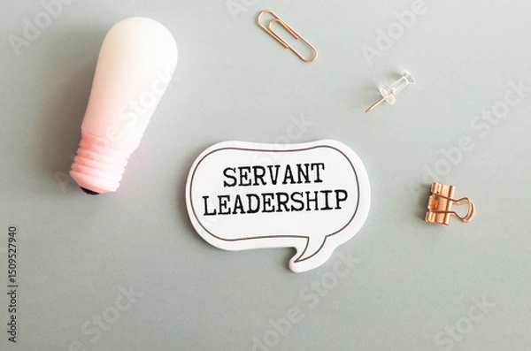 Fototapeta Servant Leadership write on paperwork isolated on Wooden Table
