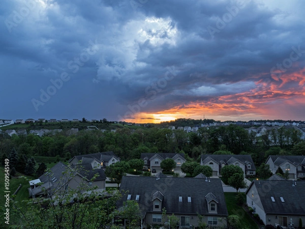 Obraz Wide view of stormy sunset sky over a residential neighborhood near Pittsburgh