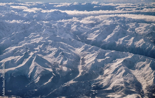 Fototapeta Caucasus mountains with snow peaks in aerial winter scene. Aerial view from plane.