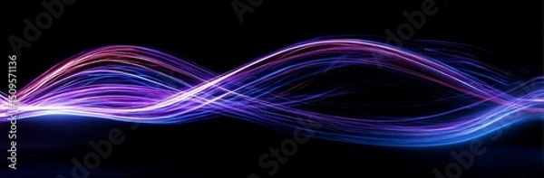 Fototapeta Vibrant, flowing light waves in a spectrum of colors against a dark background