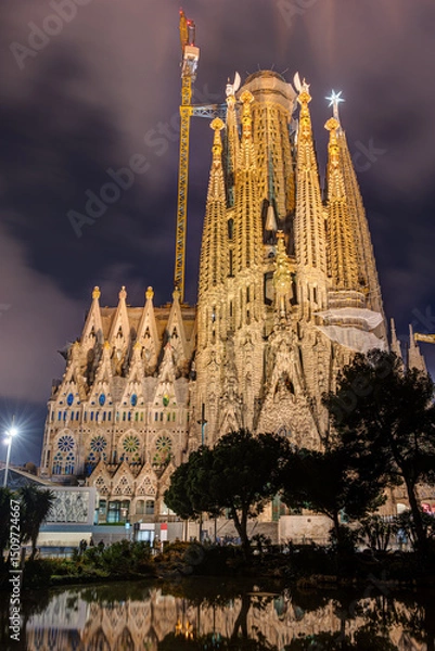 Fototapeta The illuminated Nativity Faade of the famous Sagrada Familia in Barcelona at night