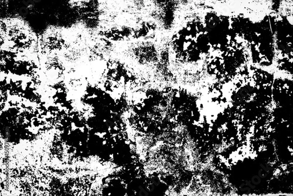 Fototapeta An abstract black and white background with ink, paint, and dirt splattered in a stained textured pattern