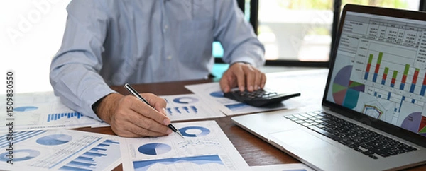 Fototapeta business analyst analyzing operating results from business and financial report. Concept of business planning ,accounting, business analysis,financial planning,data analysis.