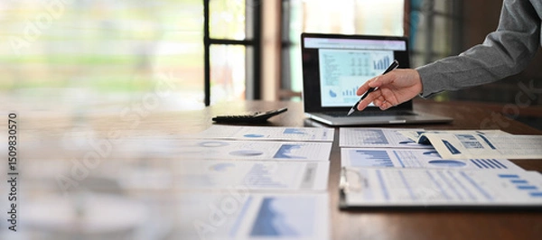 Fototapeta business analyst analyzing operating results from business and financial report. Concept of business planning ,accounting, business analysis,financial planning,data analysis.