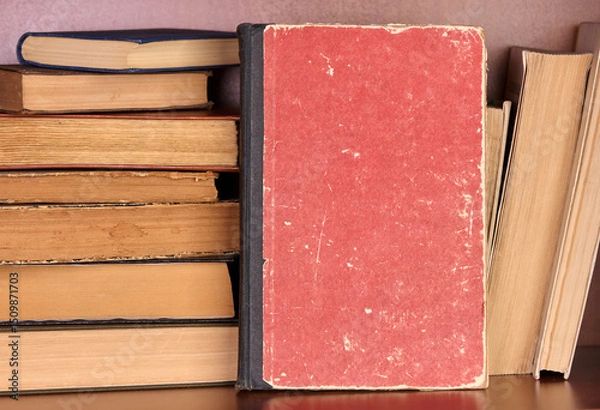 Fototapeta Old book with copy space on a bookshelf