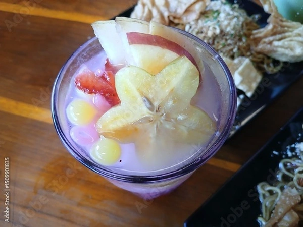 Fototapeta Es Gobak Sodor is a drink from Indonesia filled with fruit such as strawberries, jelly and star fruit. It tastes sweet and refreshing.
