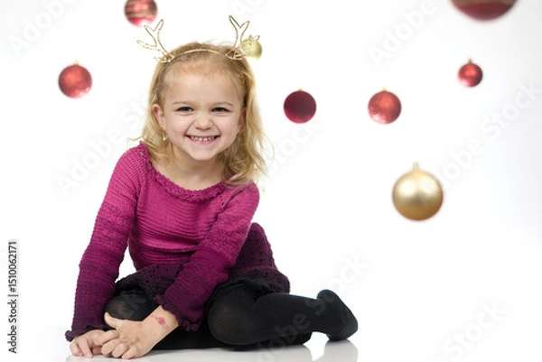 Obraz Nice little girl posing in studio for christmas portrait