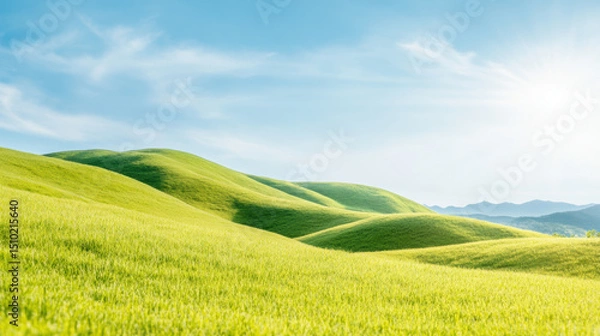 Obraz Sunny green rolling hills under clear blue sky with lush grass and distant mountains on a bright spring morning landscape