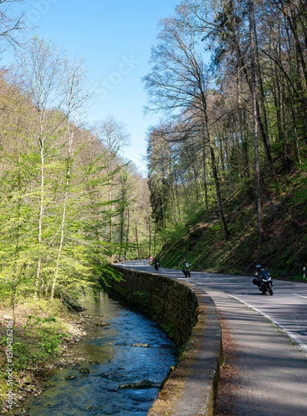 Fototapeta motorcycles on the road through the muellertal on sunny day in spring