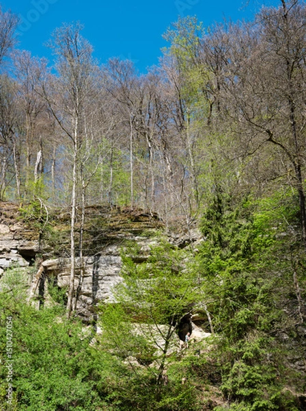 Fototapeta people scramble on the rocks in muellertal on sunny day in spring