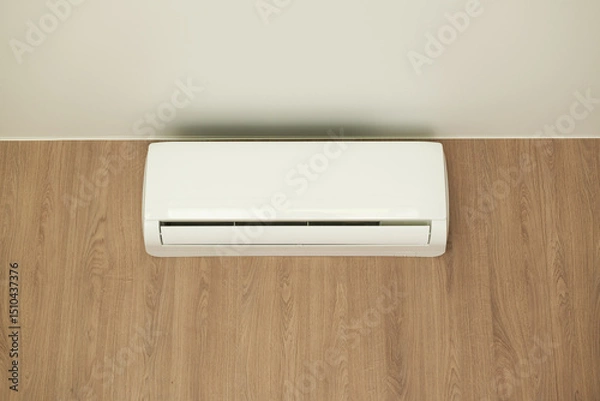 Fototapeta Air conditioner of white color on wall background, split-system in apartment