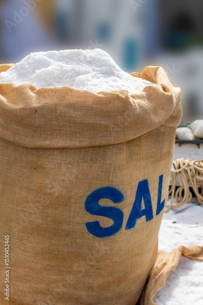 Fototapeta Close-up og a large jute sack filled with coarse sea salt at a market