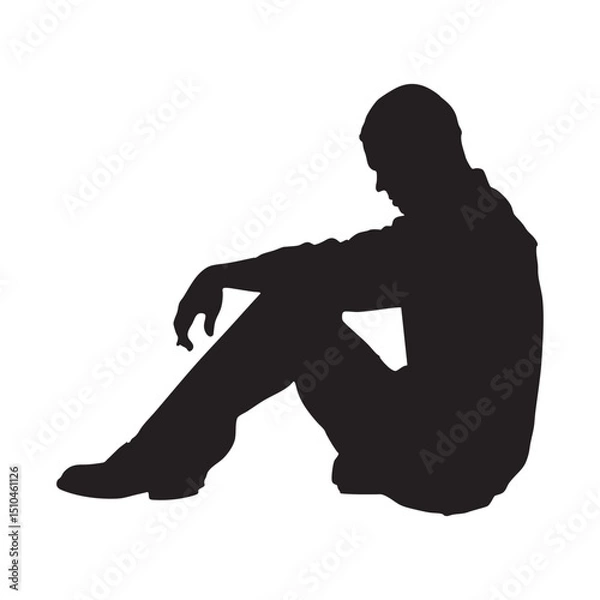 Fototapeta Silhouette of a seated person conveys a mood of contemplation, loneliness, or quiet reflection.