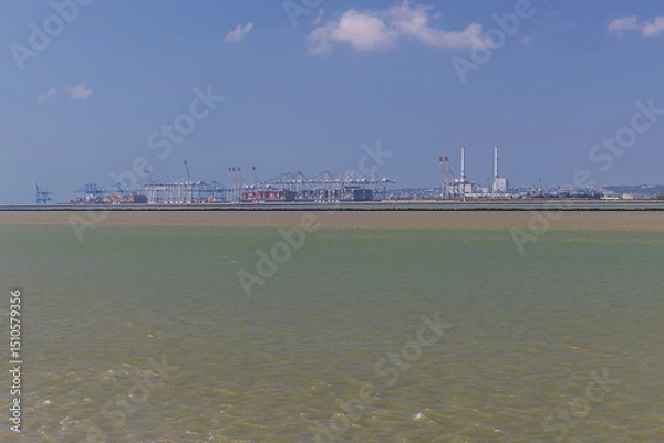 Fototapeta View across the Seine river of the harbor installations of Le Havre, seen from Honfleur, an important tourist place in Normandy
