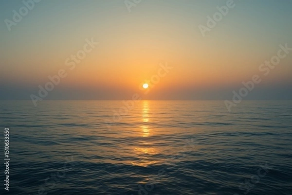 Fototapeta Soft pastel sunset above tranquil sea with smooth gradient sky and gentle light on the water