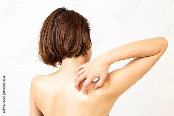 Fototapeta 背中の痒みに悩む女性