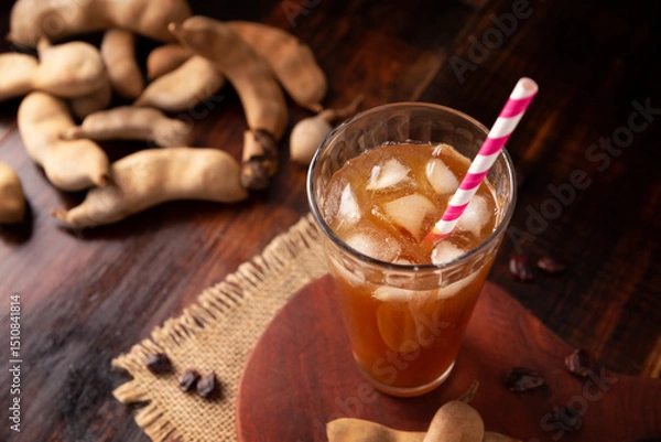 Fototapeta Tamarind drink. Agua de Tamarindo, is one of the traditional "Aguas Frescas" in Mexico. Infused drink made with tamarind to which beneficial health properties are attributed.