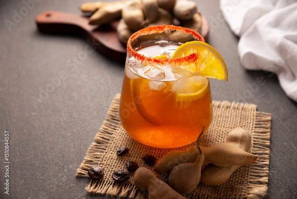 Fototapeta Tamarind drink. Agua de Tamarindo, is one of the traditional "Aguas Frescas" in Mexico. Infused drink made with tamarind to which beneficial health properties are attributed.