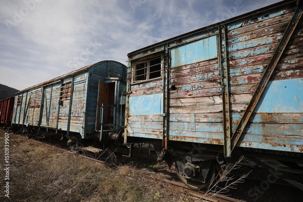 Obraz Abandoned old railway wagons at station, old train wagons in an abandoned station
