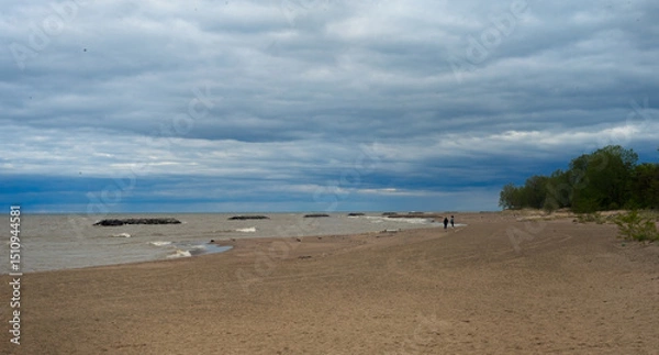 Fototapeta A chilly beach under cloudy skies at Presque Isle State Park on Lake Erie.