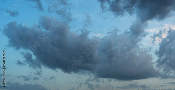 Obraz Beautiful bright sunset evening sky with dramatic clouds.