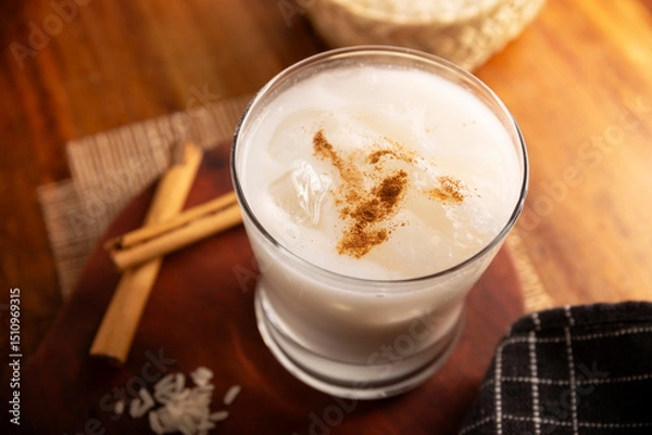 Fototapeta Agua de Horchata. Also known as horchata de arroz, it is one of the traditional fresh waters (aguas frescas) in Mexico, it is made with fresh water, rice and cinnamon.